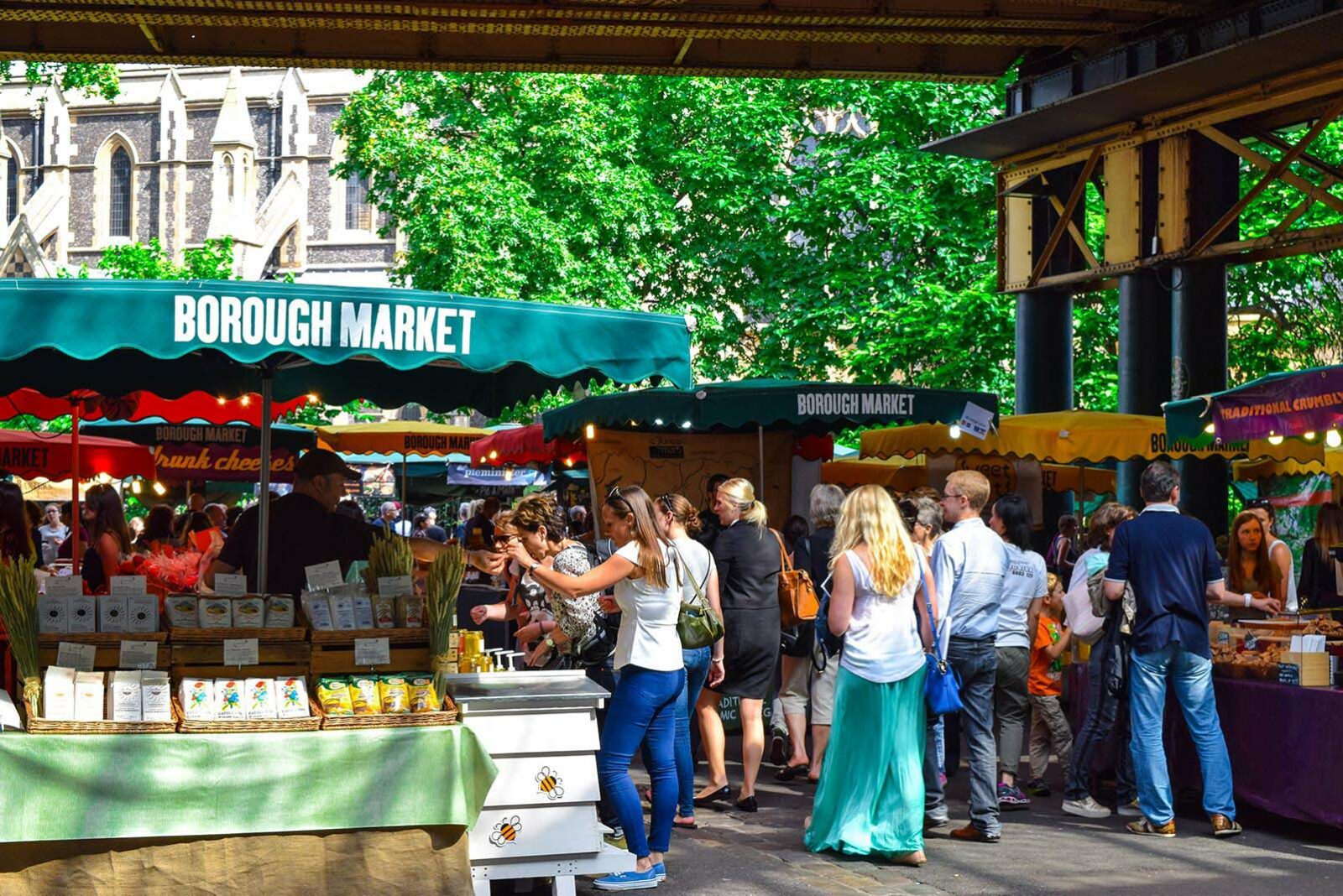 a busy outdoor market on a sunny day