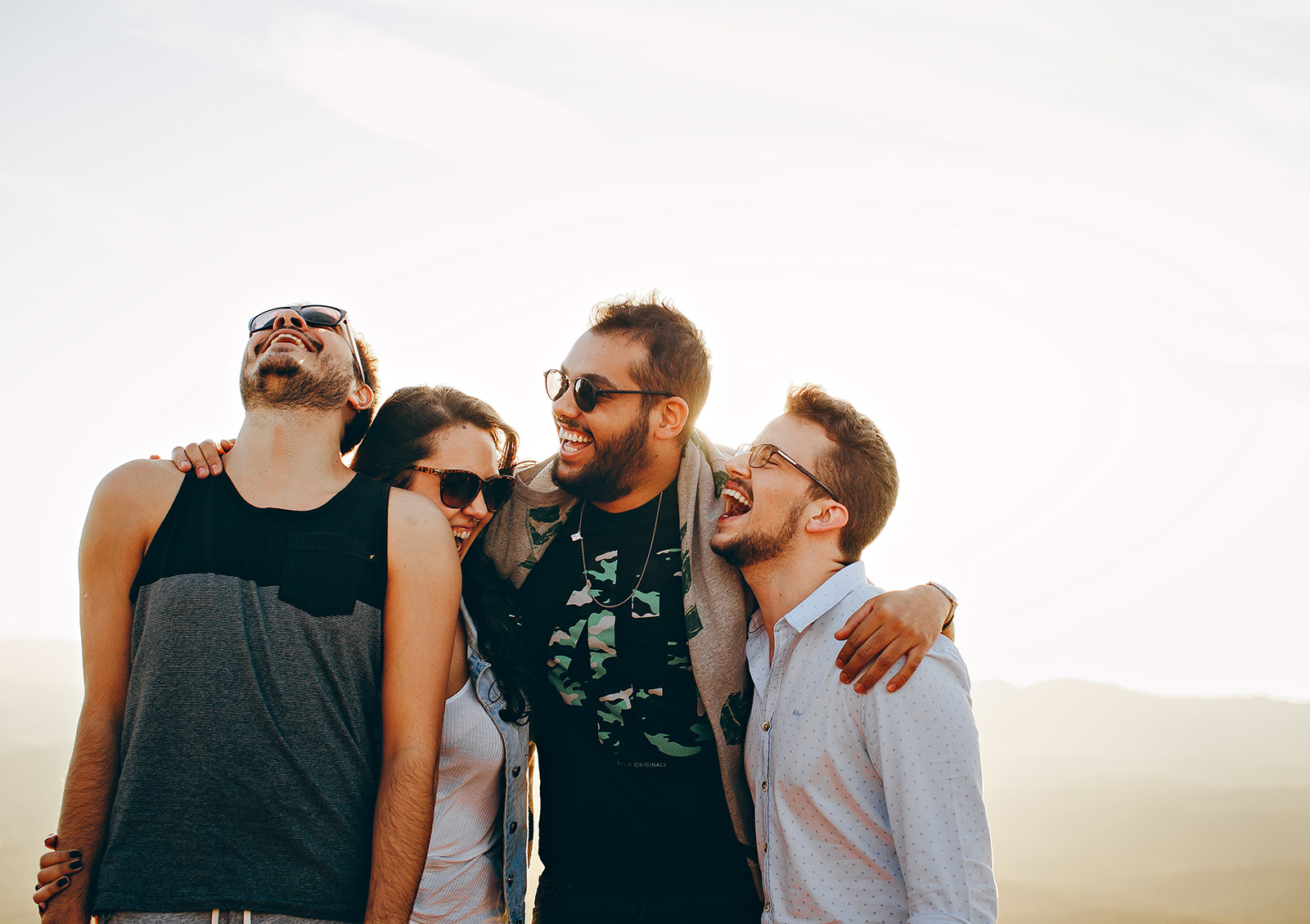 group of men and women smiling