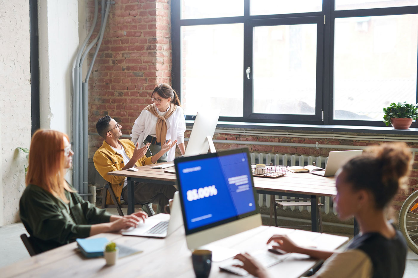 people working in a design studio work environment