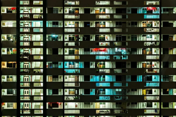 a close up on dozens of apartment balconies at night