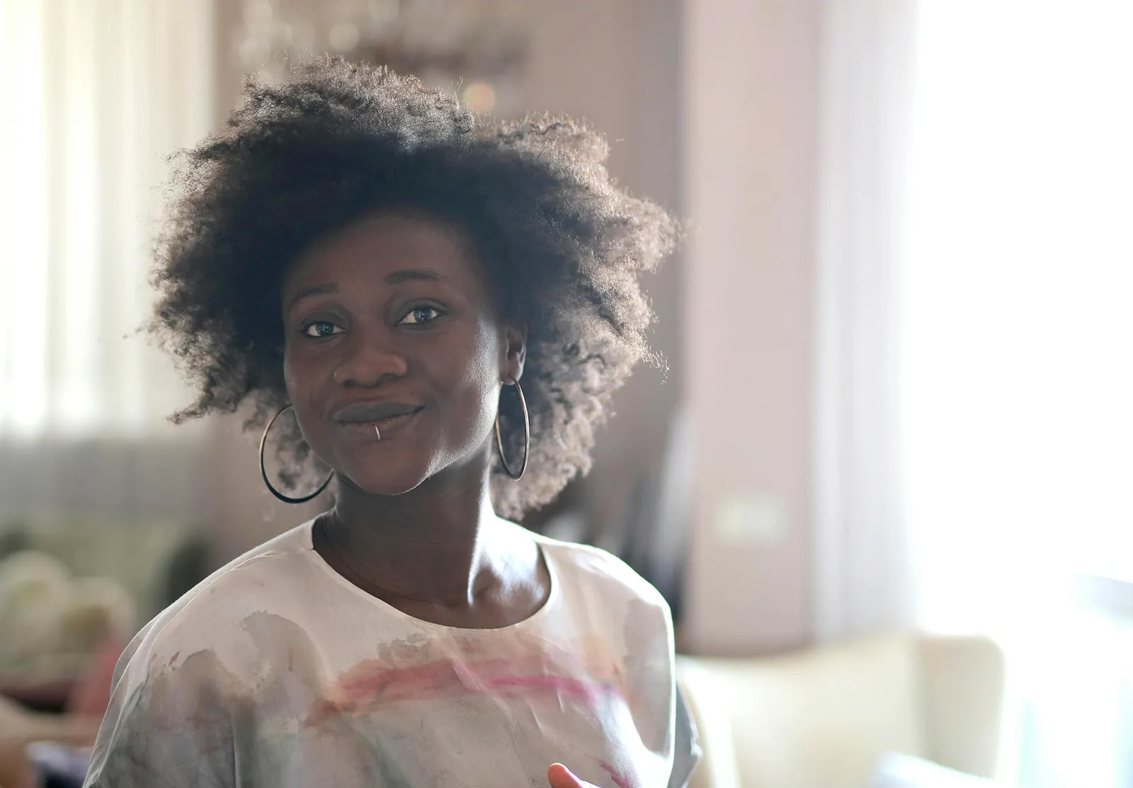 a black woman smiling at the camera