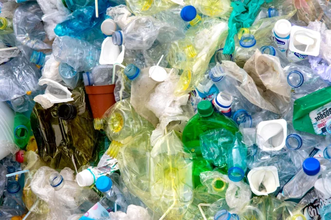 a pile of plastic bottles crumpled up for recycling