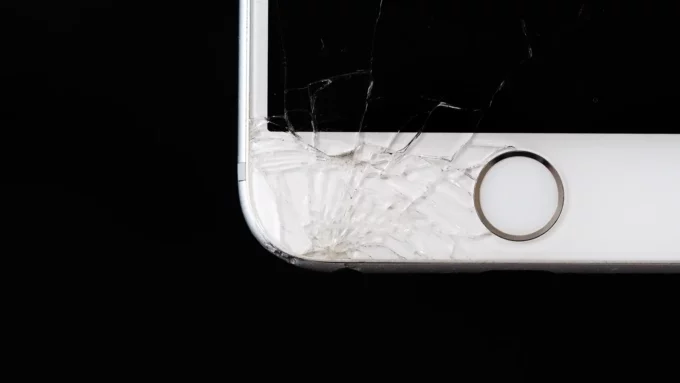 a closeup of a cracked iphone screen