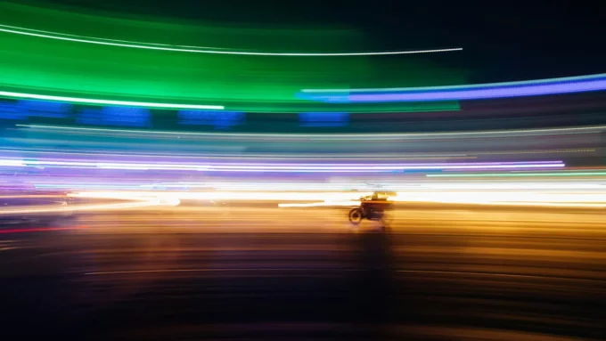 streaks of color and a motorcycle produced by time lapse photography