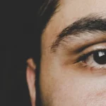 a closeup of a the right eye and side of face of a middle eastern man