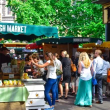 a busy outdoor market on a sunny day