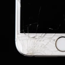 a closeup of a cracked iphone screen