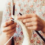 person holding crochet