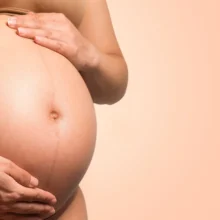 a white woman is pregnant -- a view of her belly