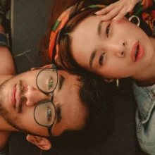 a top down view of a woman and man looking at camera