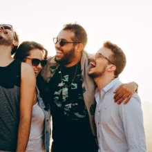 group of men and women smiling