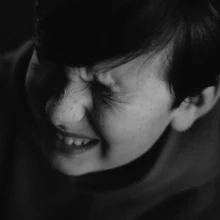 boy grimacing in pain