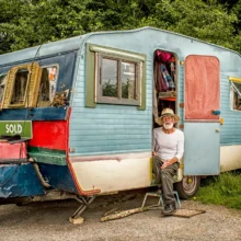 man sitting in trailer home