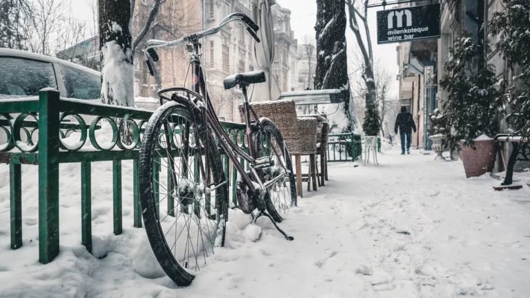 a sidewalk in a city completely covered in snow