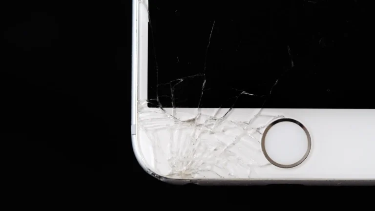 a closeup of a cracked iphone screen