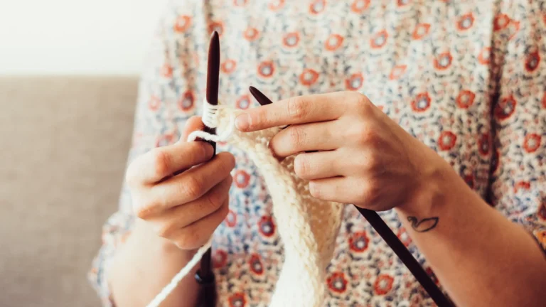 person holding crochet