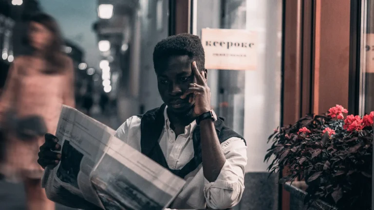 man reading a newspaper