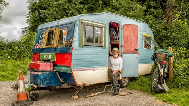 man sitting in trailer home